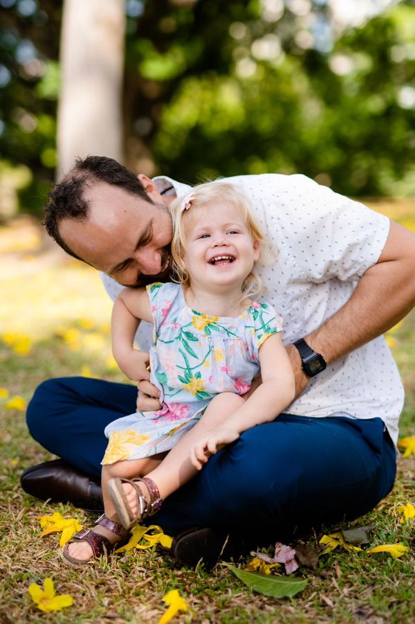 A dad with a daughter on the park